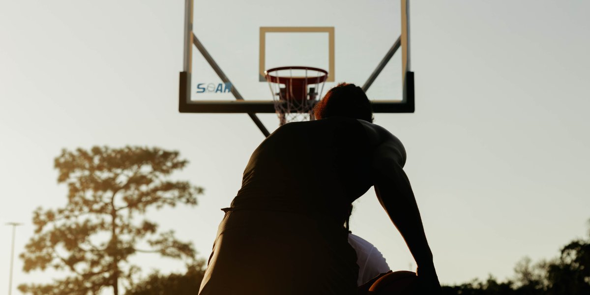 Hooper driving to a SOAR hoop at sunset