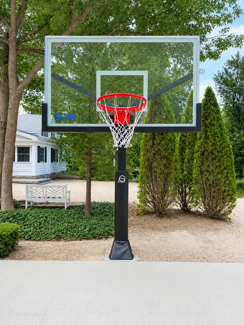 SOAR basketball hoop in front of a white house